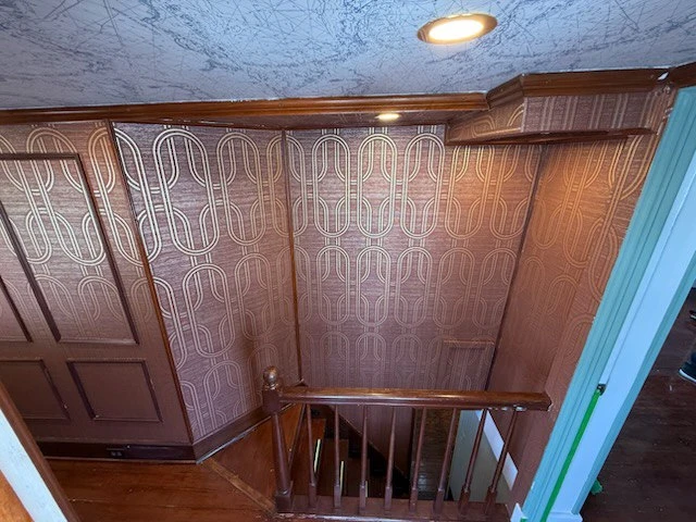 Historic plaster wall preparation for wallpaper installation